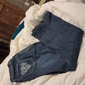 boot cut ,dark blue  ms firefly jeans  with embellished pockets.